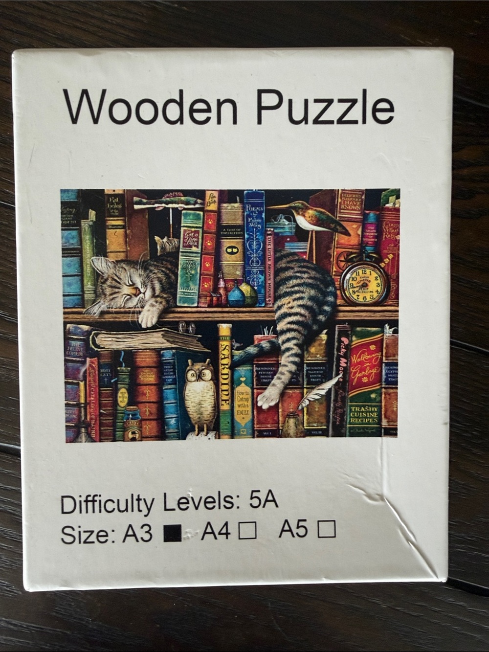 Wooden Puzzle Cat on Bookshelf